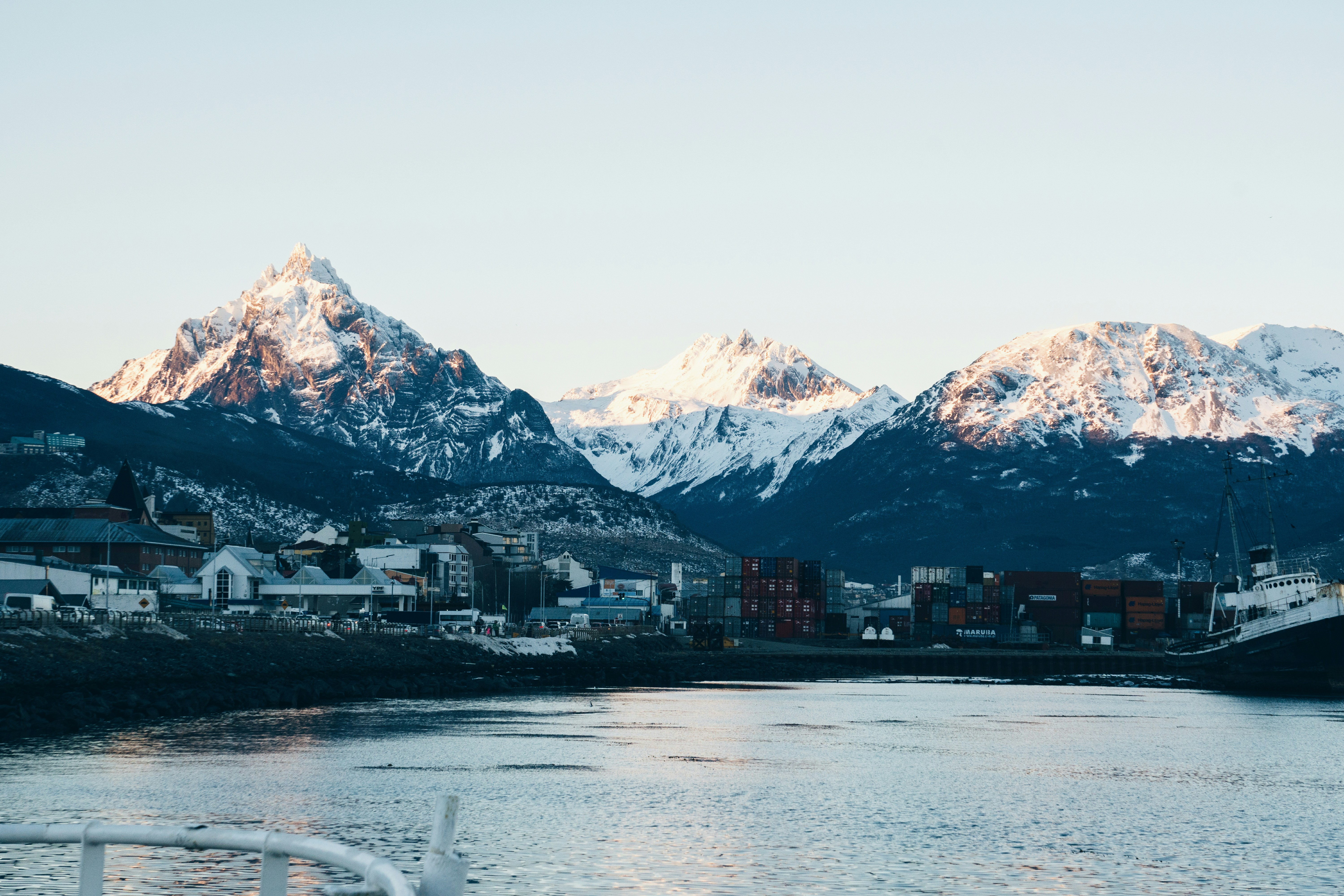 a body of water with mountains in the background