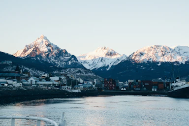 a body of water with mountains in the background