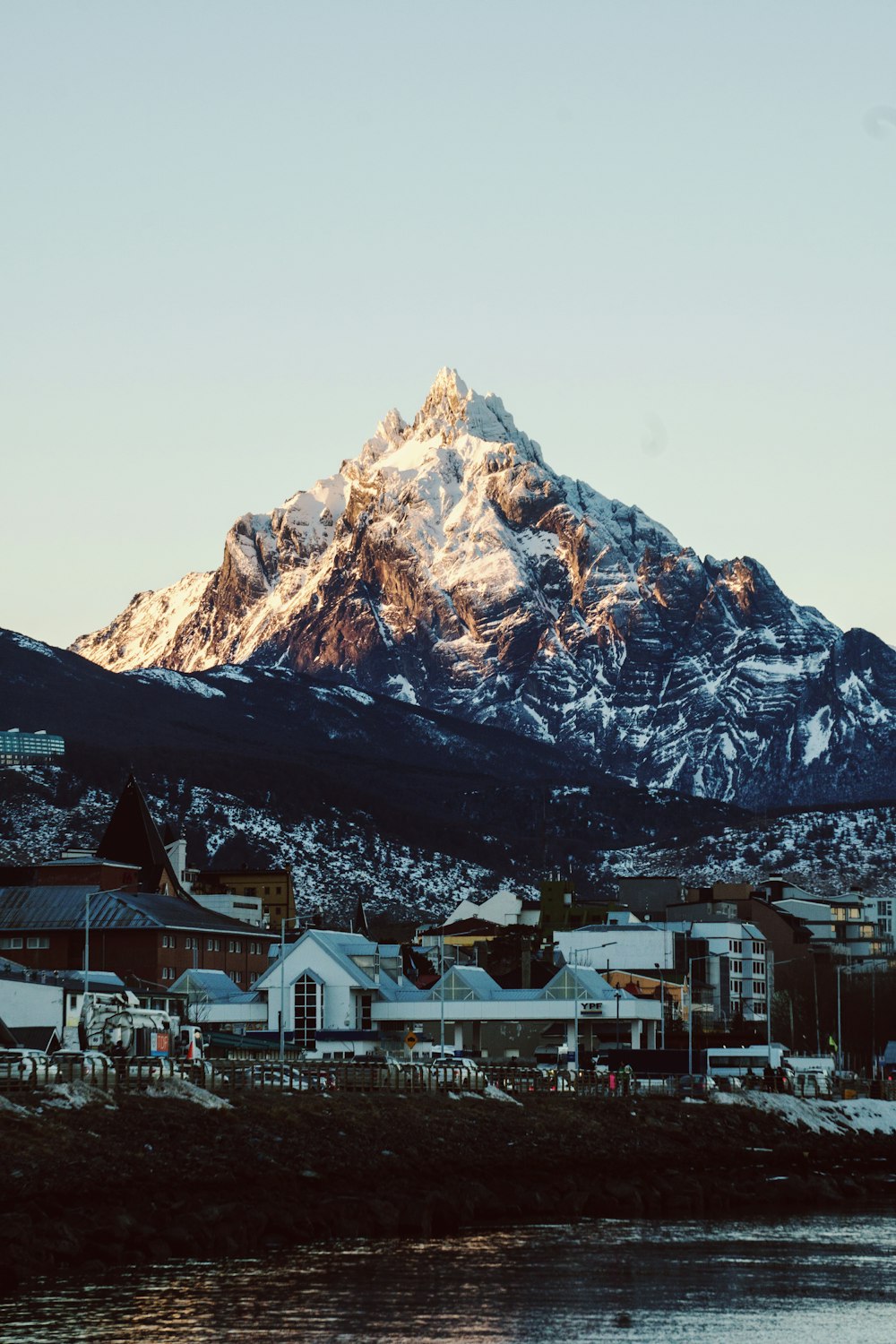 a snow covered mountain is in the distance