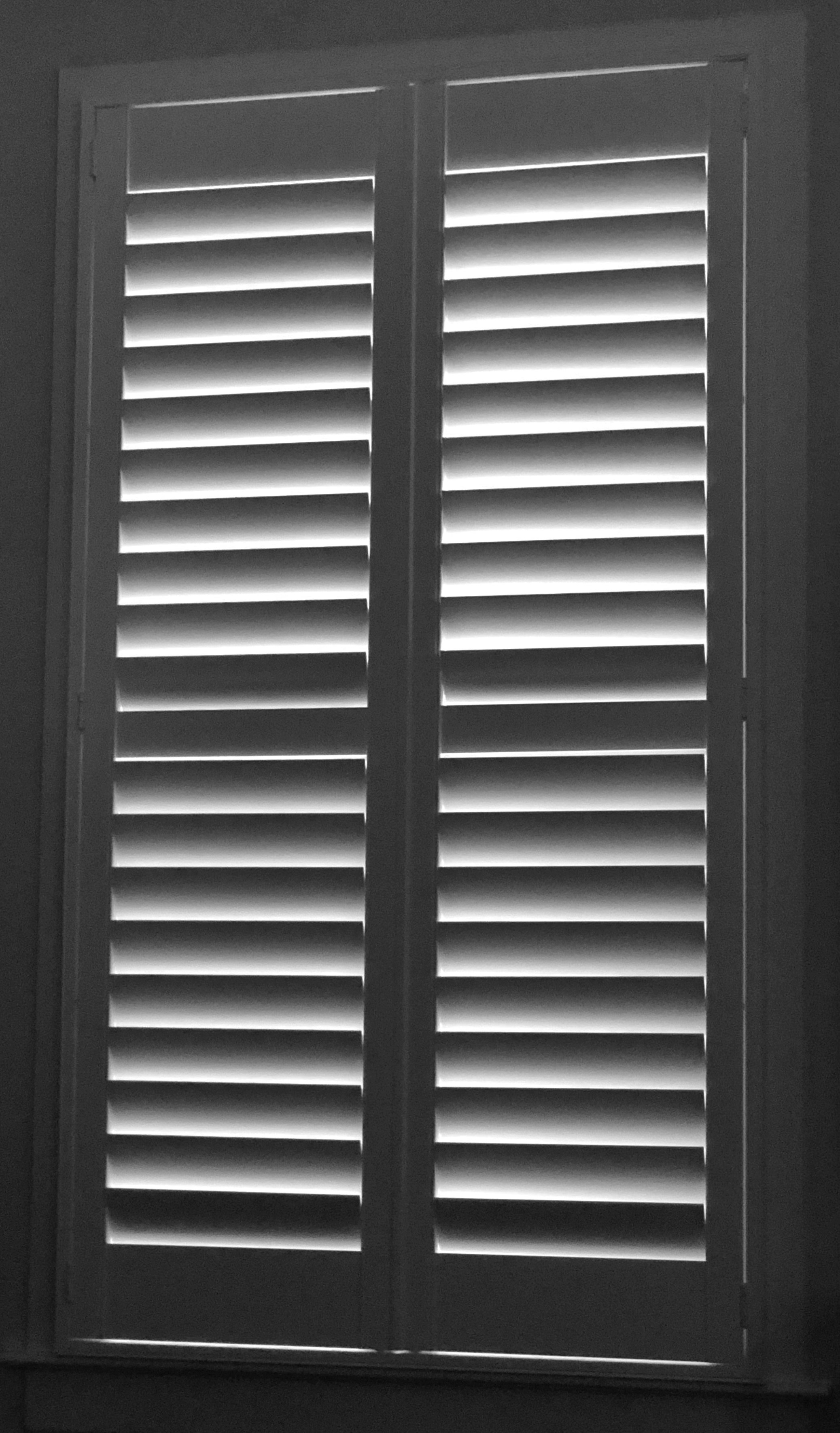Master bedroom with white plantation shutters, Holt Norfolk