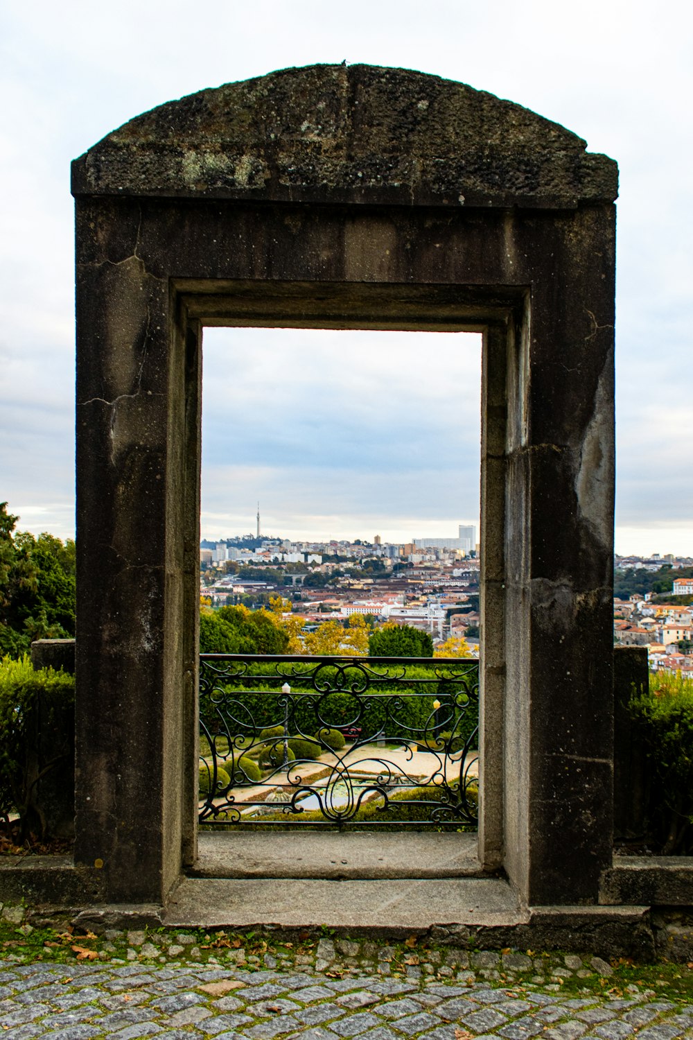 a view of a city through a gate