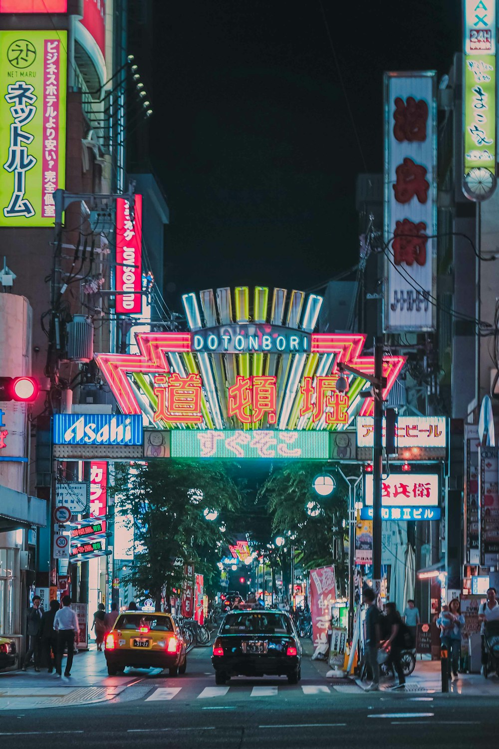 a city street filled with lots of neon signs