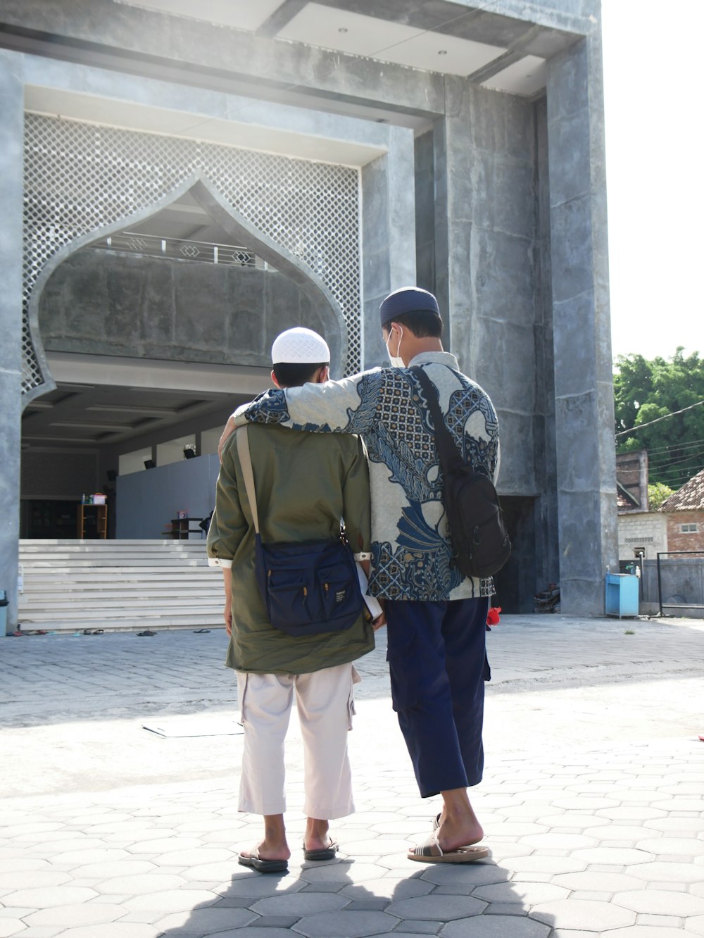 a couple of men standing next to each other