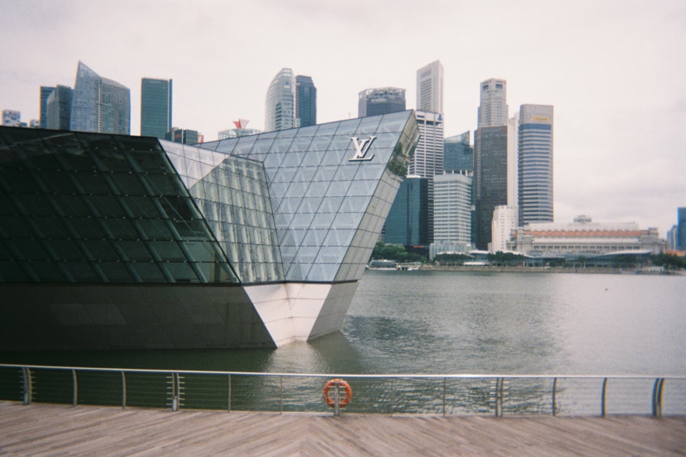 A view of a city from across a body of water photo – Free Film photography  Image on Unsplash