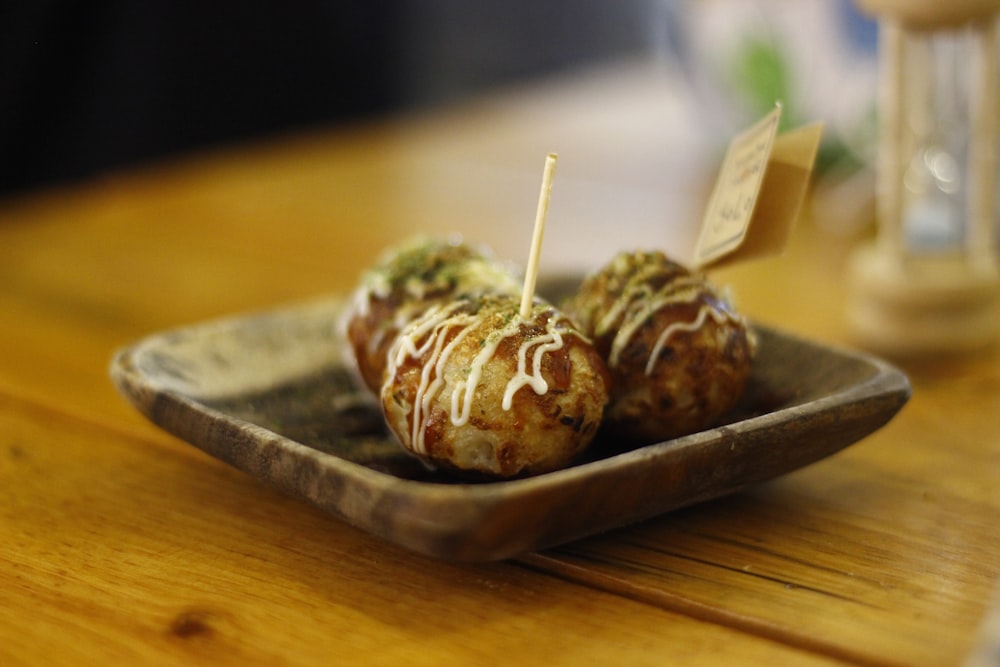 a wooden table with a plate of food on it