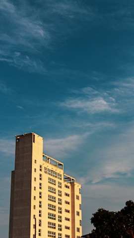 a tall building with a clock on the top of it