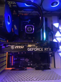 a close up of a computer tower with blue lights