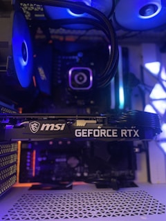 a close up of a computer tower with blue lights