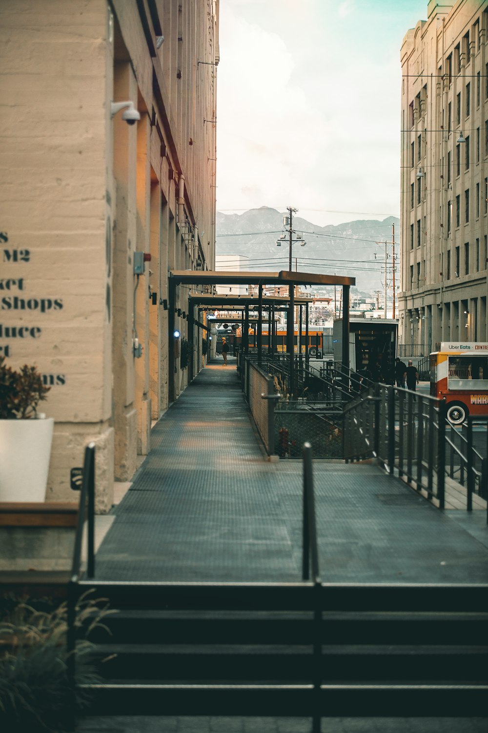 a city street with buildings and a bus