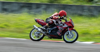 a person riding a motorcycle on a race track