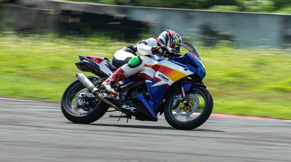 a person riding a motorcycle on a race track