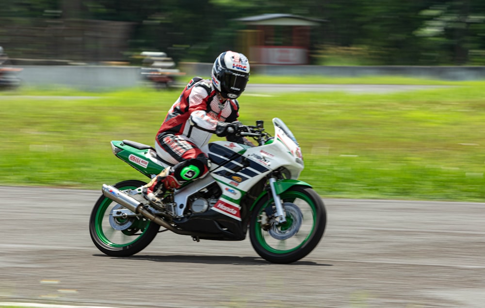 a person riding a motorcycle on a track