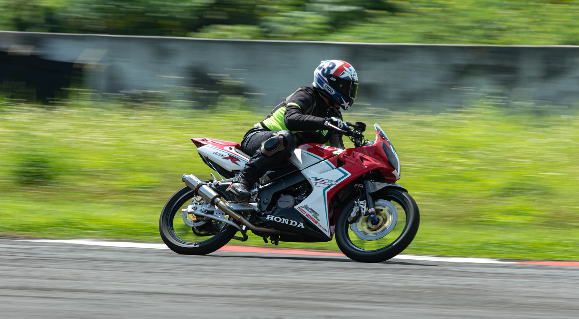 a person riding a motorcycle on a race track