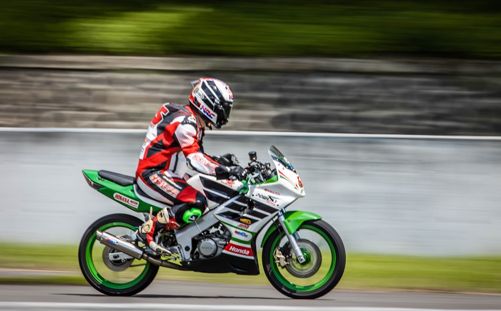 a person riding a motorcycle on a race track