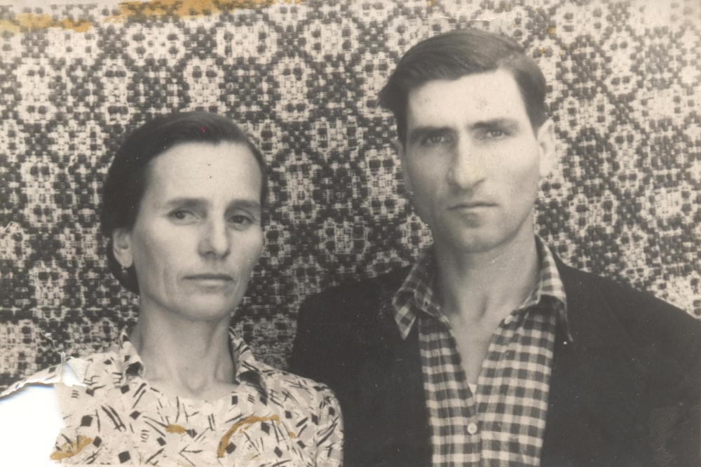 an old photo of a man and a woman