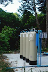 a row of water tanks sitting next to each other
