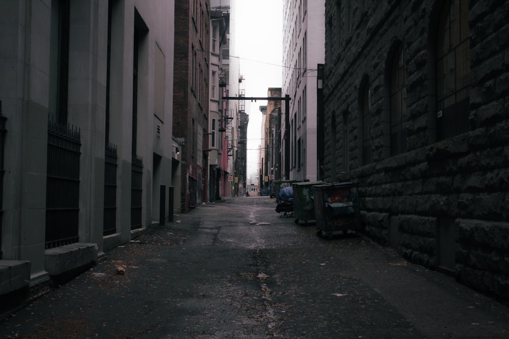 a narrow city street lined with tall buildings