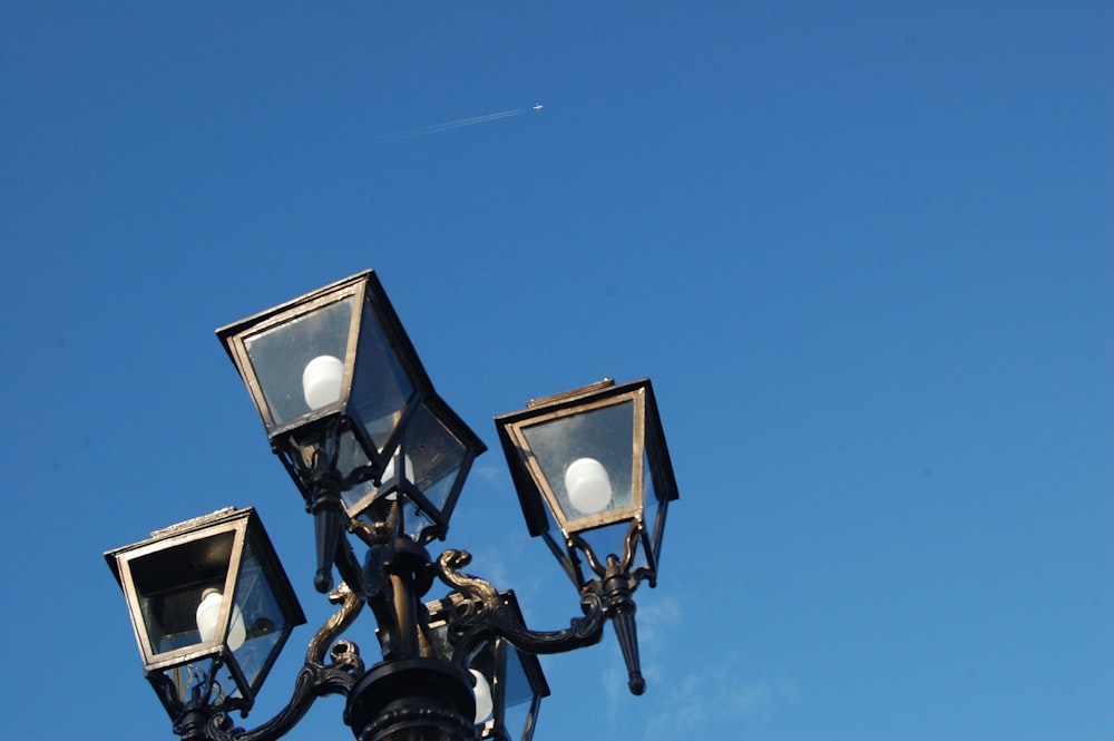 a street light with three lights attached to it