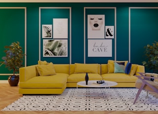 a living room with green walls and a yellow couch