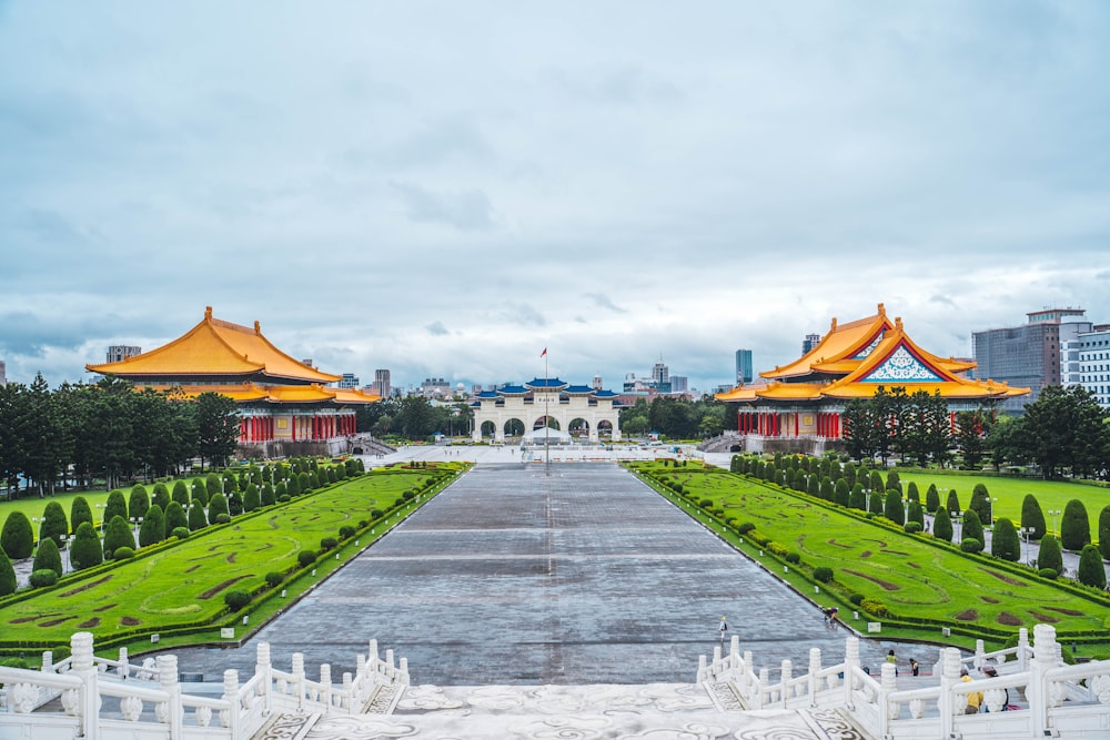 a view of a park with a lot of trees and buildings in the background