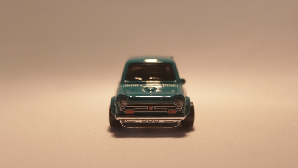 a toy car sitting on top of a table