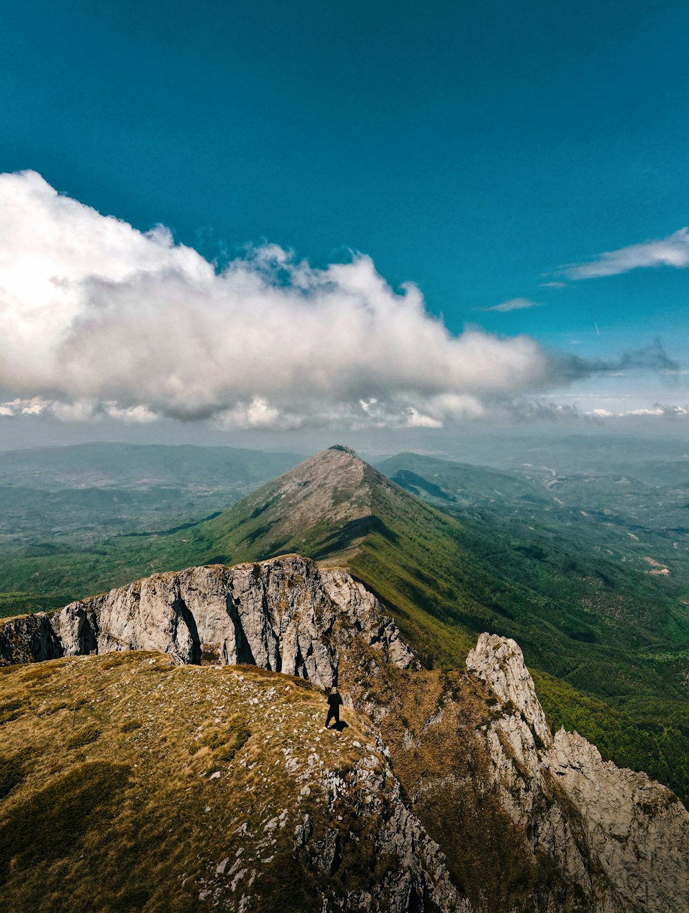 a person standing on top of a mountain