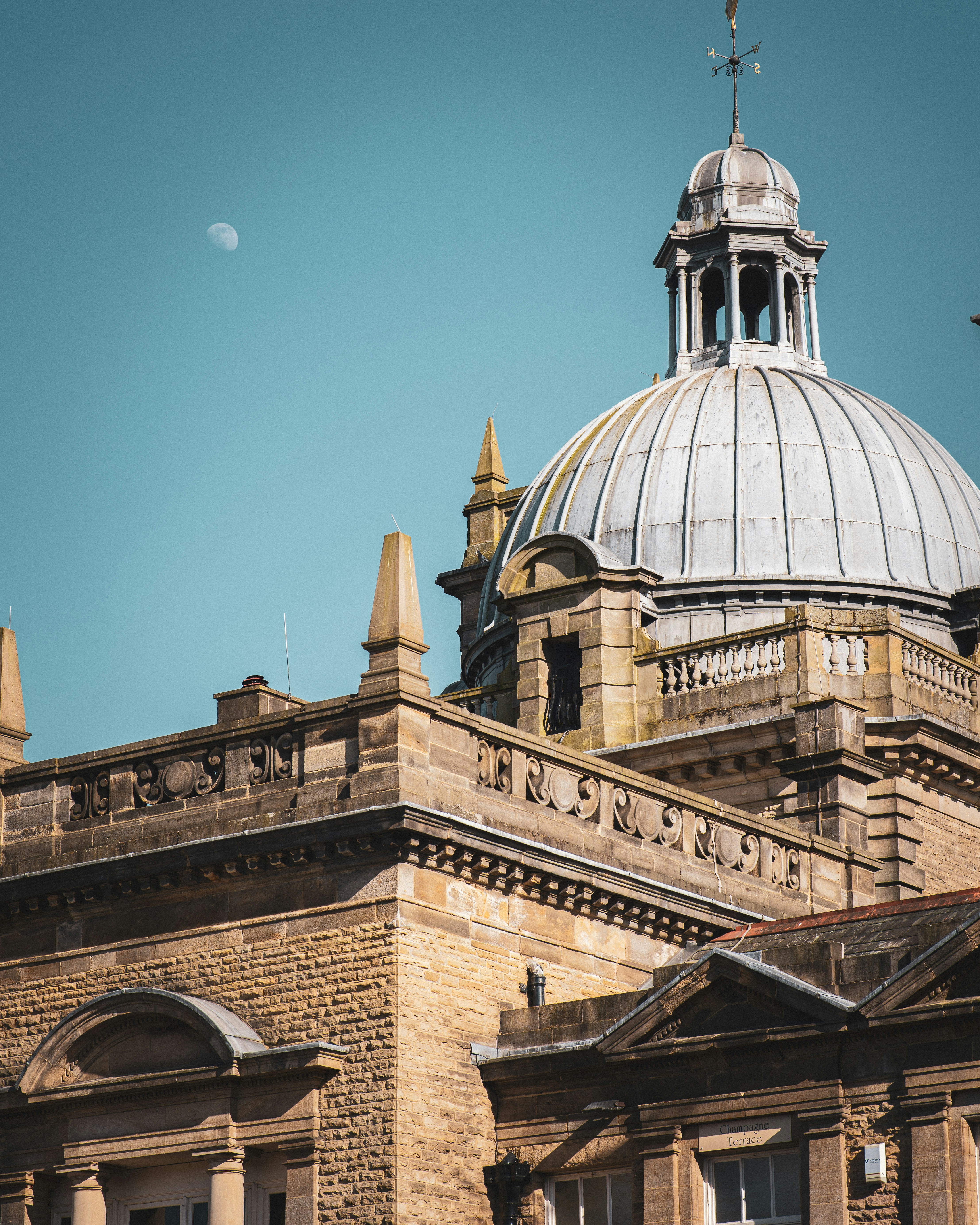 a building with a dome and a clock on it
