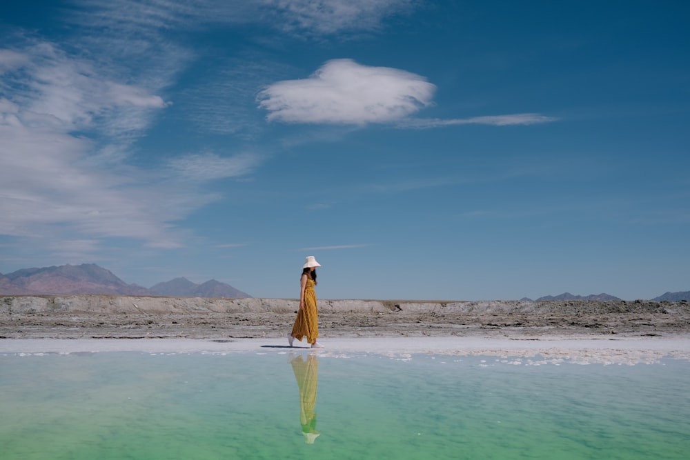 a person standing in the middle of a body of water