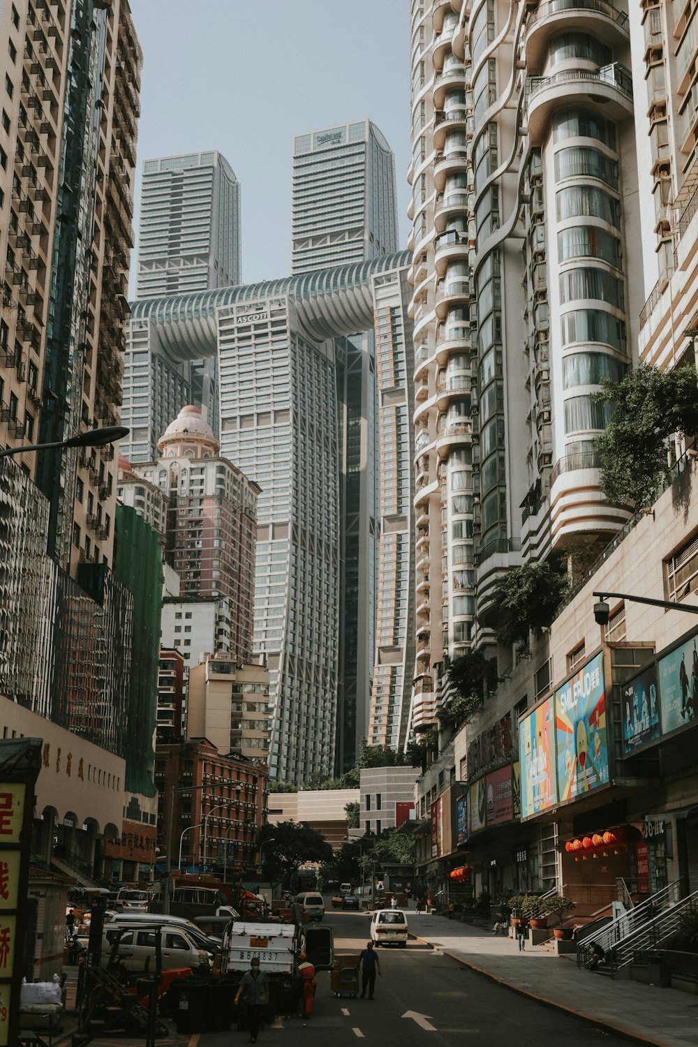 a city street with tall buildings in the background