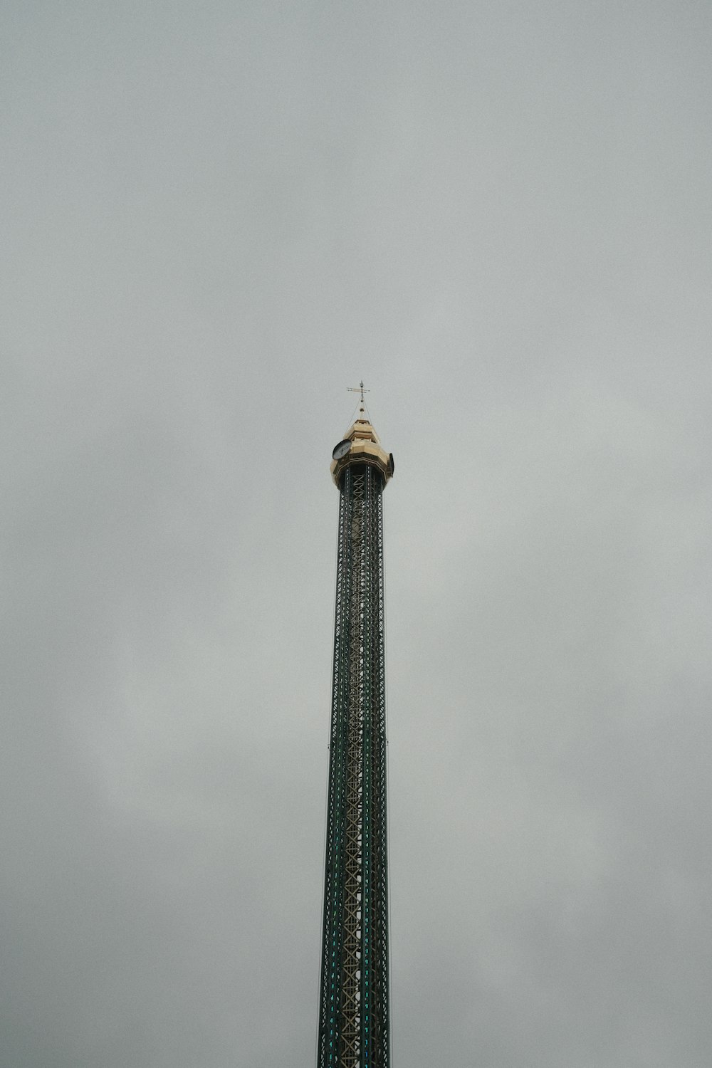 a tall tower with a clock on the top of it