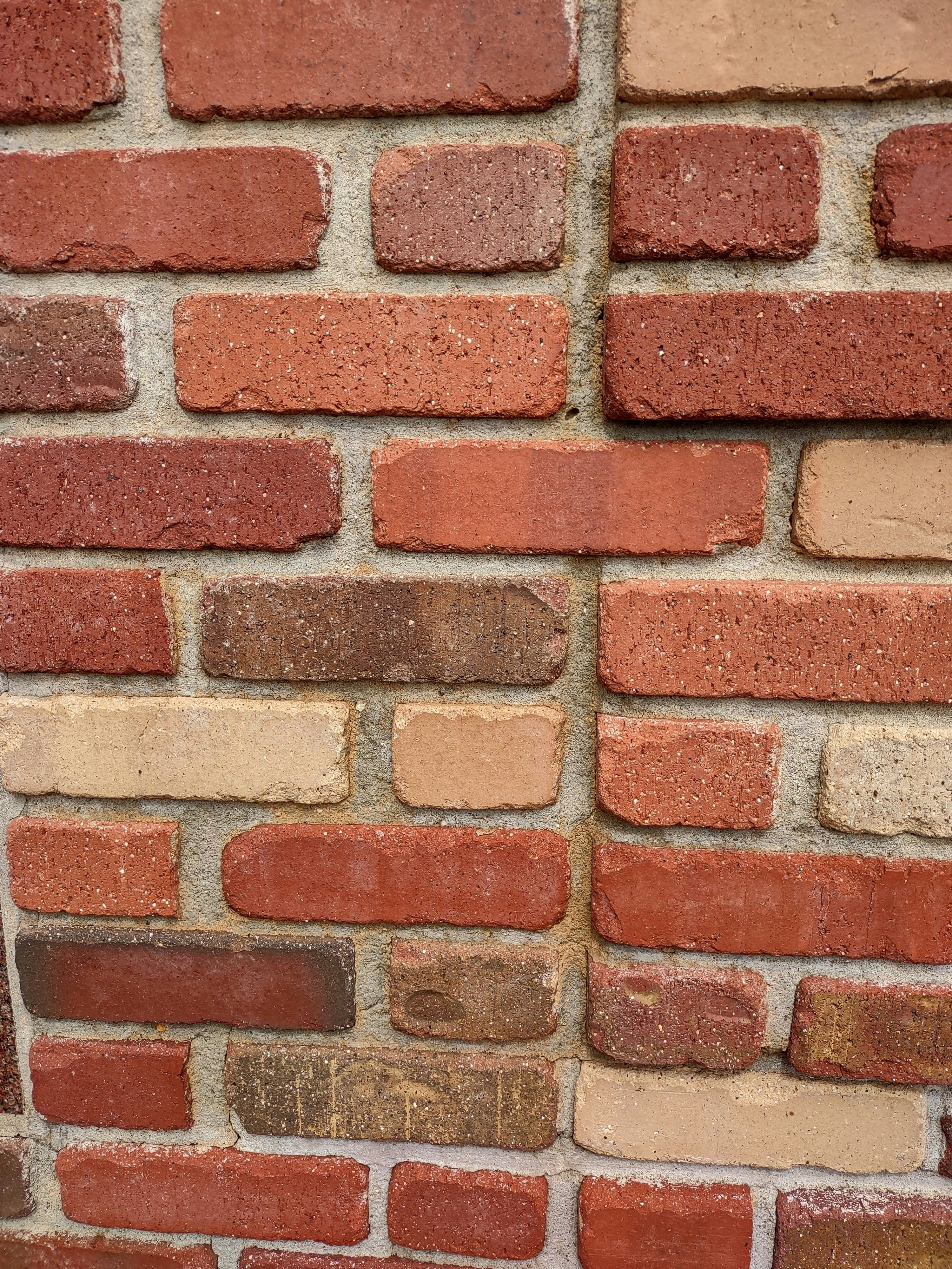UCB Tire Brick Rough — rough finish tire-shaped bricks in a boundary wall by Unique Concrete Builders Kenya