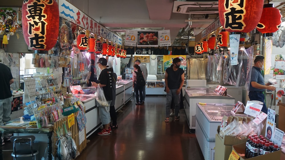 a group of people standing inside of a store