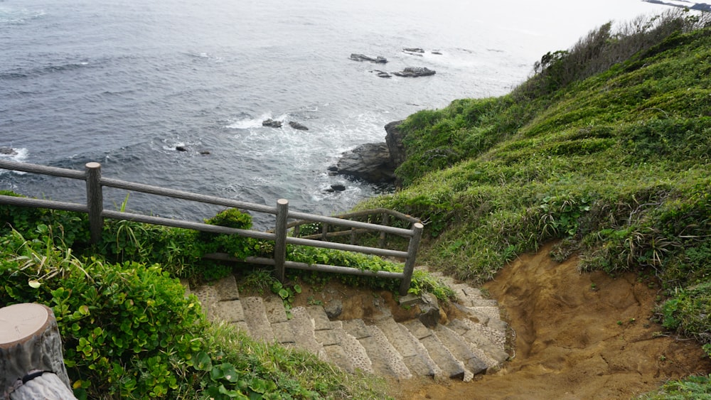 a set of stairs leading down to the ocean