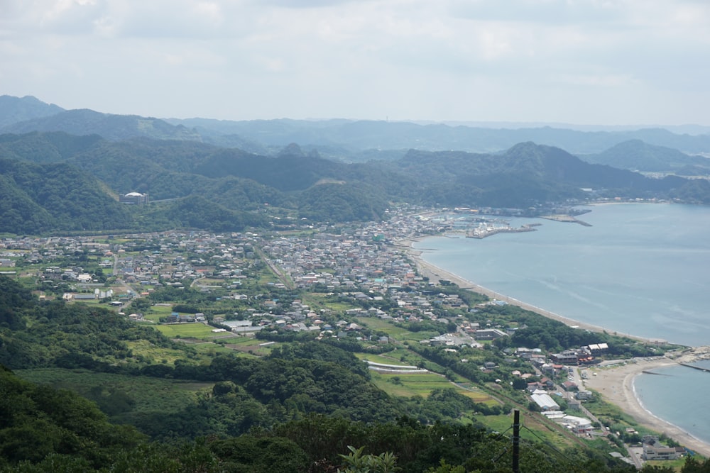 a view of a town and a body of water