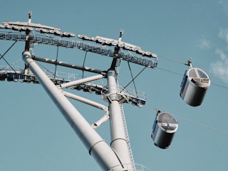A garage door off its track with cables visible, ready for repair.