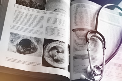 a medical book with a stethoscope on top of it