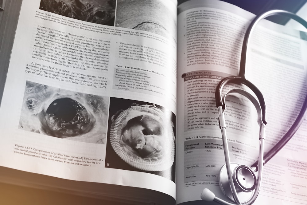 a medical book with a stethoscope on top of it