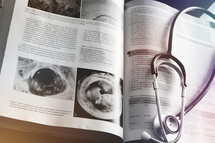 Medical textbook with a stethoscope