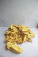 Close-up of hands sorting fresh jackfruit pieces for value addition.