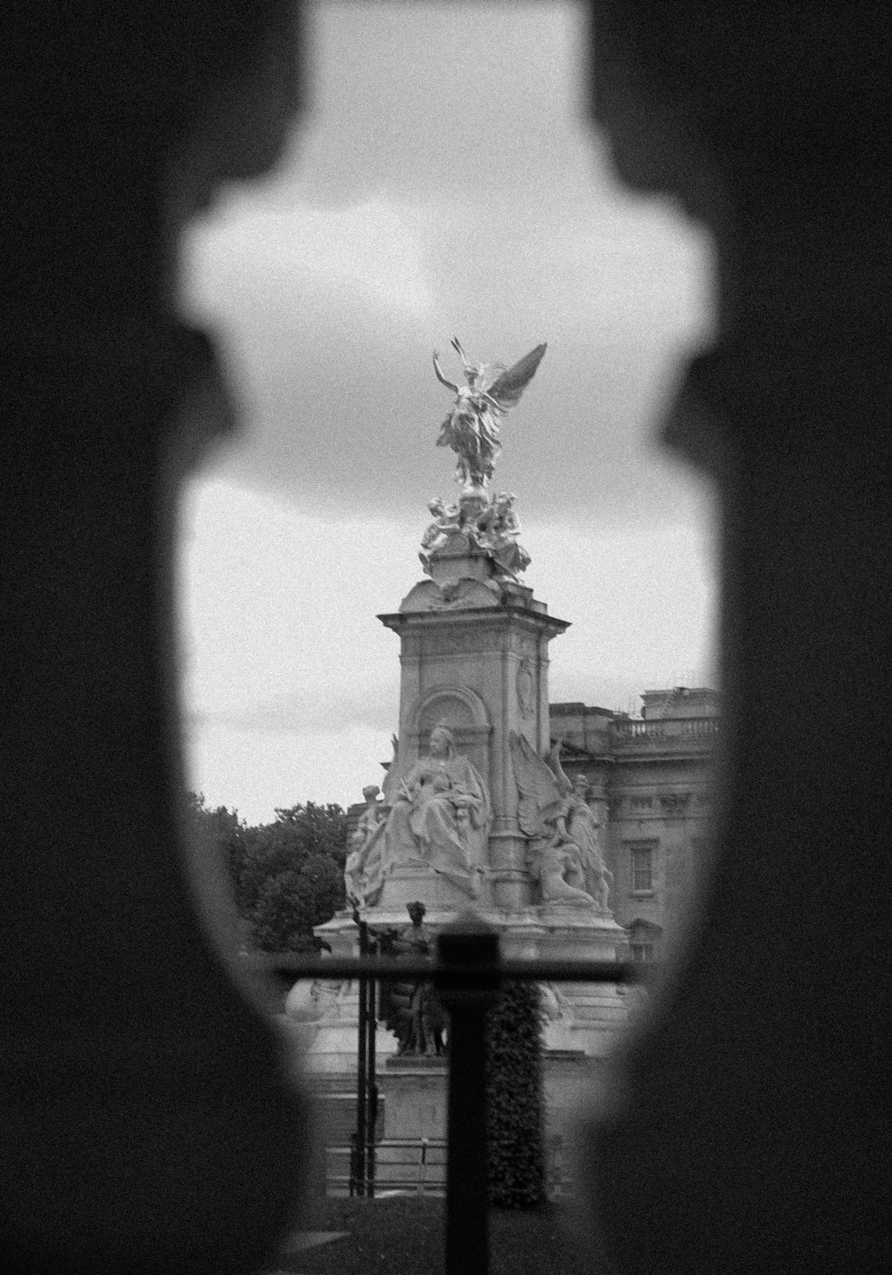 a black and white photo of a statue