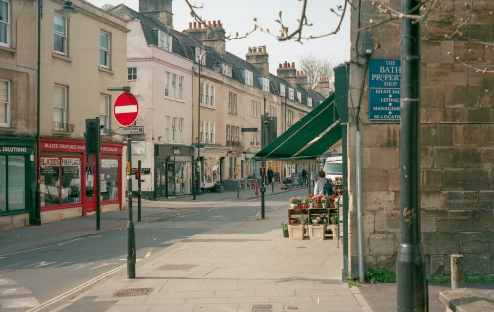 a city street with people walking on the sidewalk