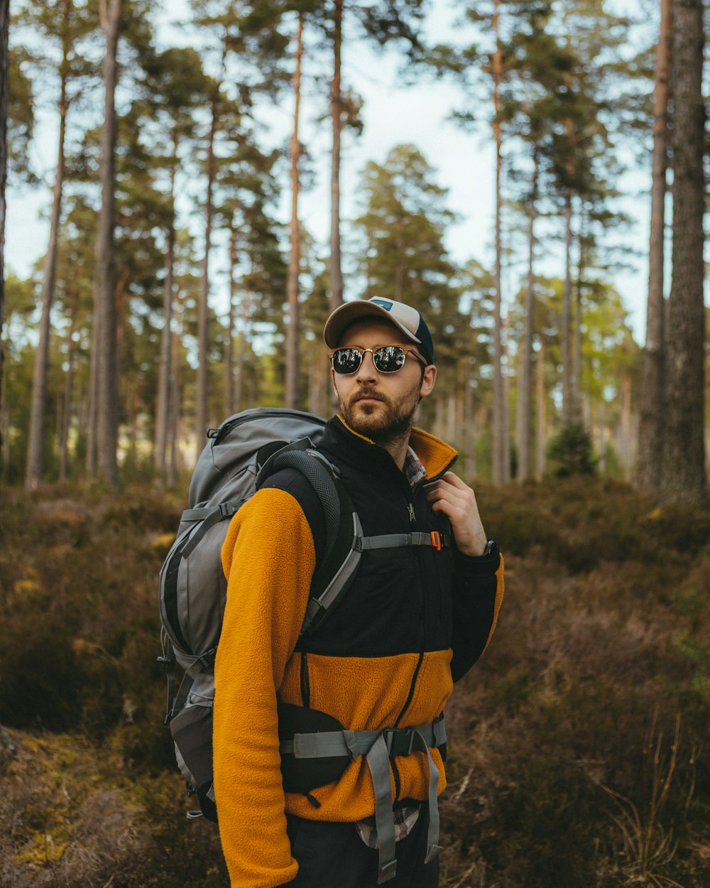 a man with a backpack in the woods