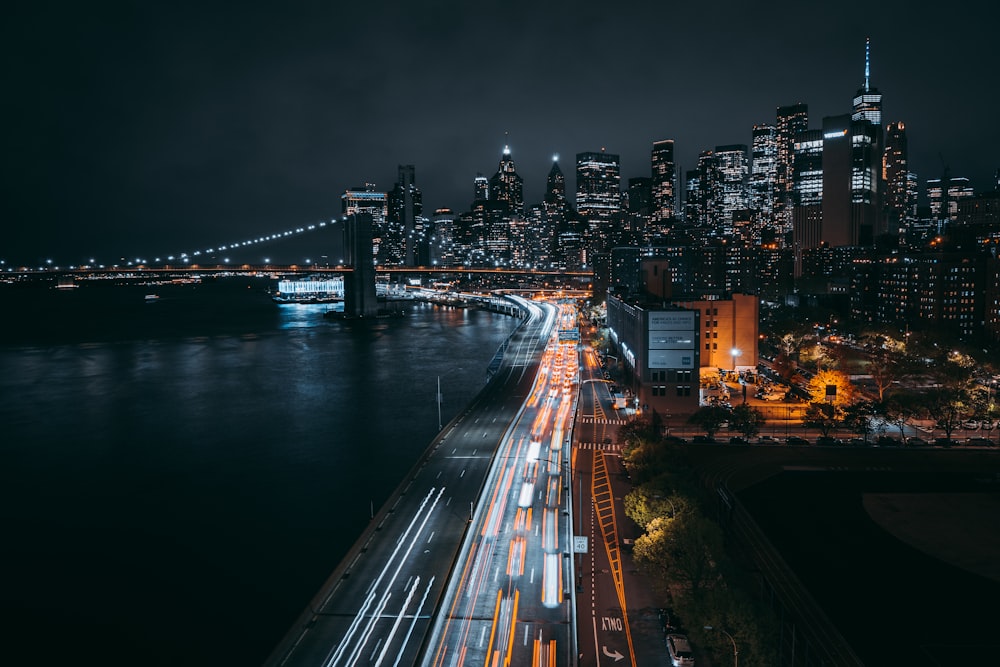 a view of a city at night from a bridge