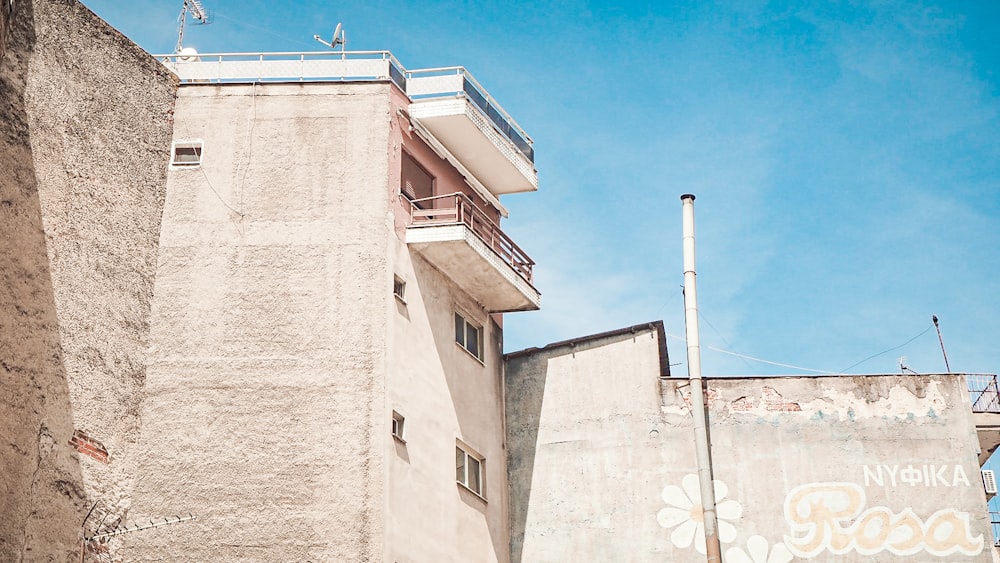 a tall building with a sign on the side of it