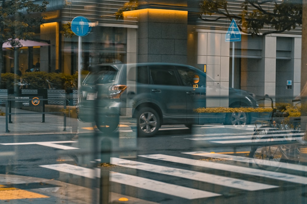 a reflection of a car in a window