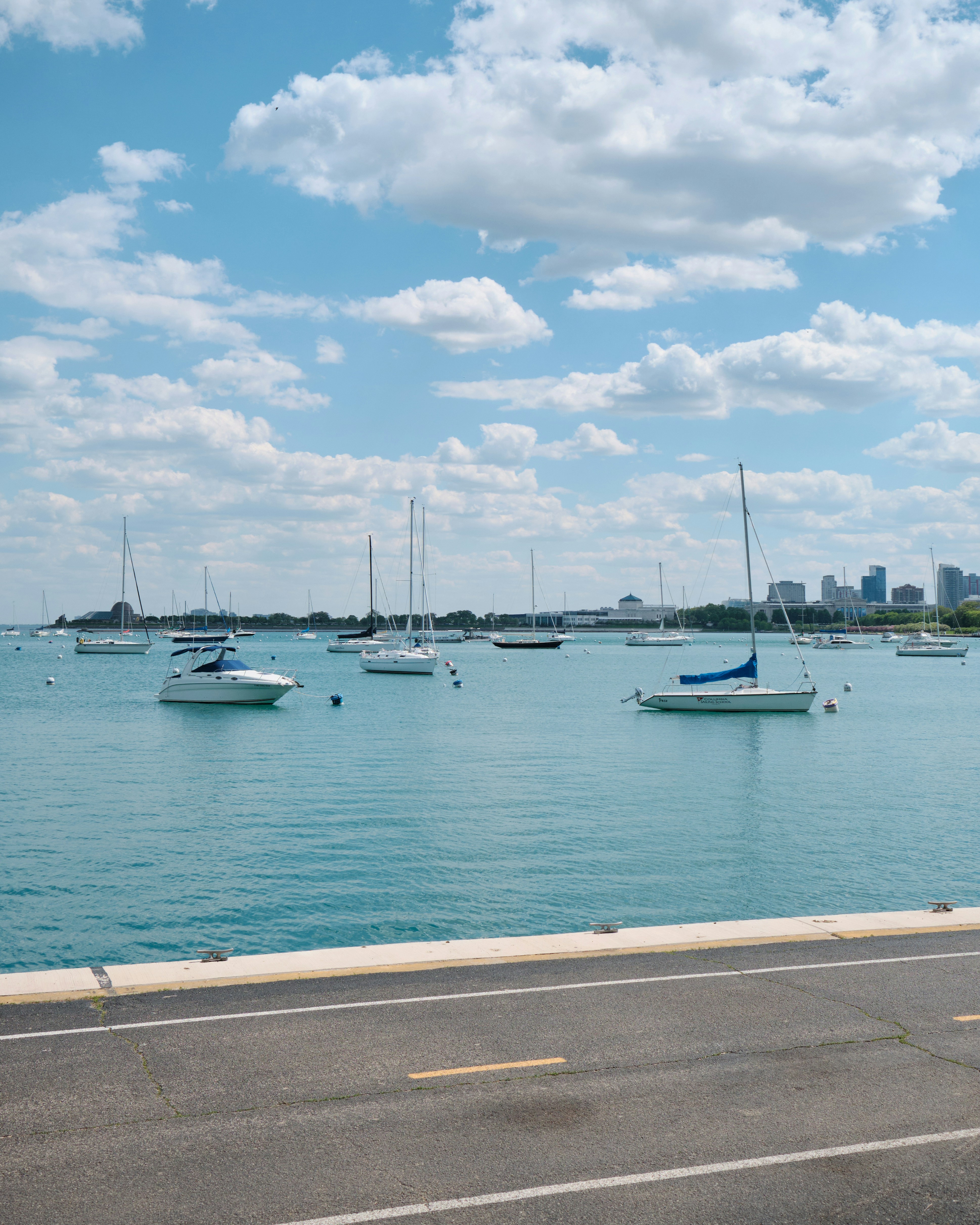 a group of boats floating on top of a large body of water