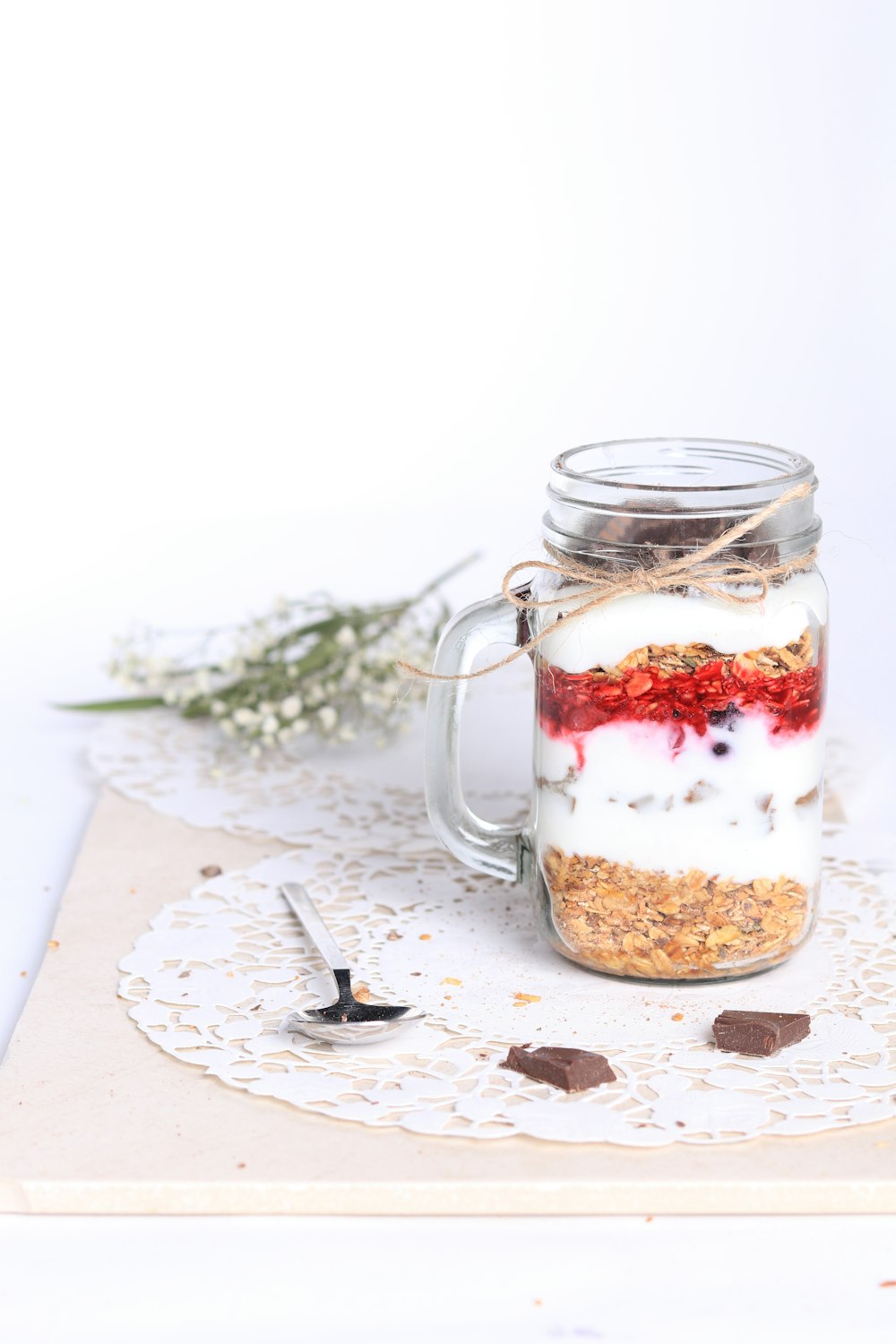 a jar of food sitting on top of a doily