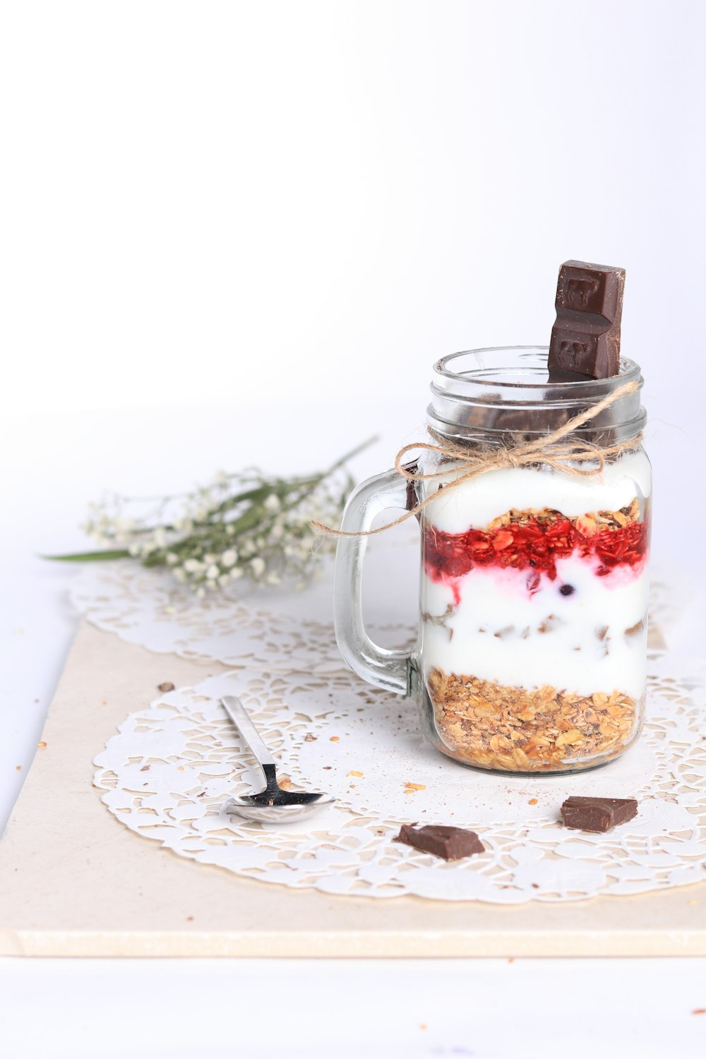a mason jar with a chocolate bar on top of it