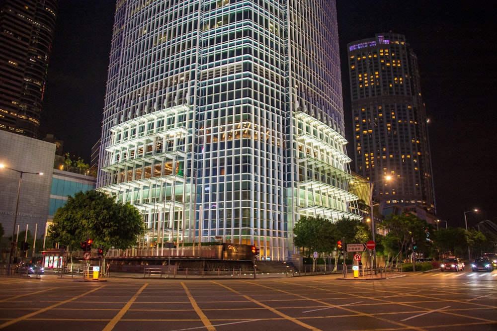 a large glass building lit up at night