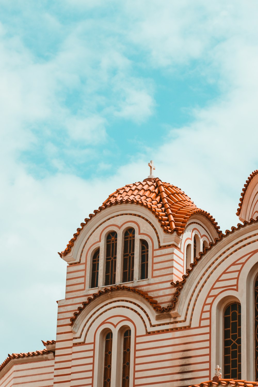 a church with a cross on the top of it